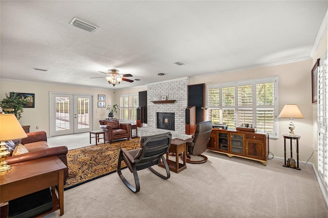 20861 SW 81st Loop, Dunnellon, FL 34431 - living room featuring carpet floors, ornamental molding, a fireplace, plenty of natural light, and ceiling fan