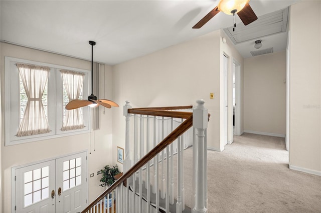 20861 SW 81st Loop, Dunnellon, FL 34431 - hallway with an upstairs landing, attic access, carpet, baseboards, and french doors