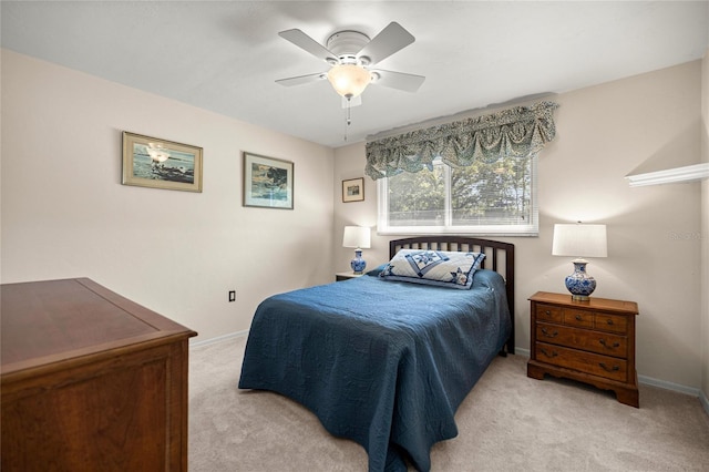 20861 SW 81st Loop, Dunnellon, FL 34431 - bedroom featuring light colored carpet, baseboards, and a ceiling fan