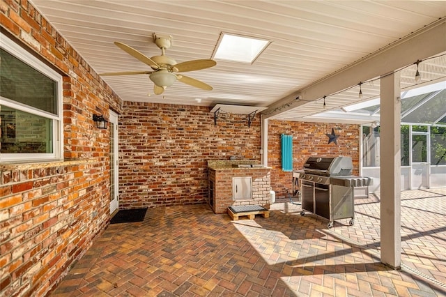 20861 SW 81st Loop, Dunnellon, FL 34431 - view of patio with exterior kitchen, a ceiling fan, a lanai, and area for grilling