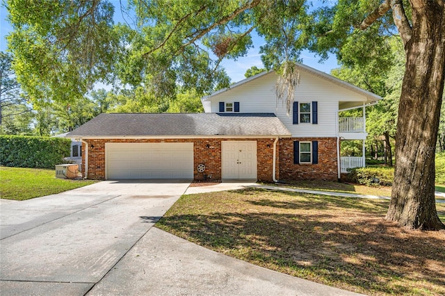 20861 SW 81st Loop, Dunnellon, FL 34431 - traditional-style house with a garage, concrete driveway, brick siding, a front yard, and roof with shingles