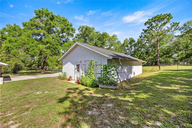 20861 SW 81st Loop, Dunnellon, FL 34431 - view of property exterior featuring view of wooded area and an outdoor structure