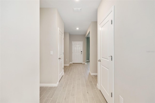 1875 NW 44 Court Rd, Ocala, FL 34482 - hallway with baseboards, light wood finished floors, and recessed lighting