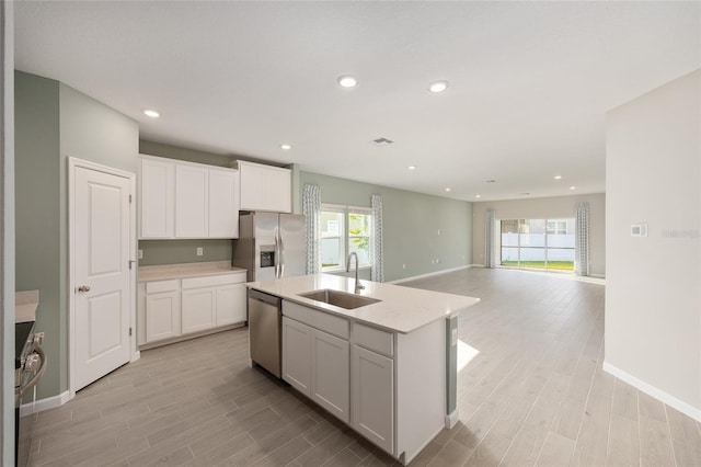 1875 NW 44 Court Rd, Ocala, FL 34482 - kitchen featuring a sink, appliances with stainless steel finishes, light wood-type flooring, healthy amount of natural light, and recessed lighting