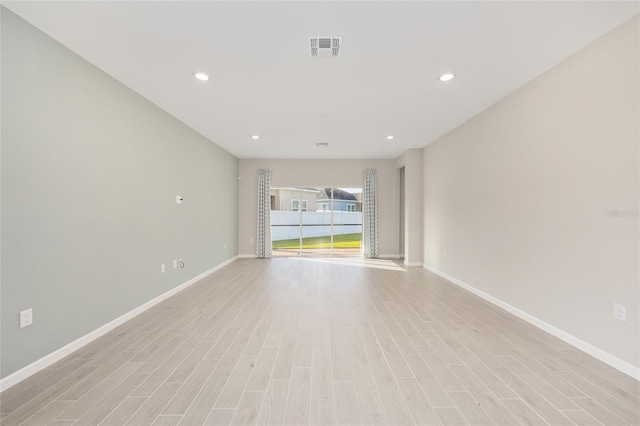 1875 NW 44 Court Rd, Ocala, FL 34482 - unfurnished room with baseboards, light wood finished floors, and recessed lighting