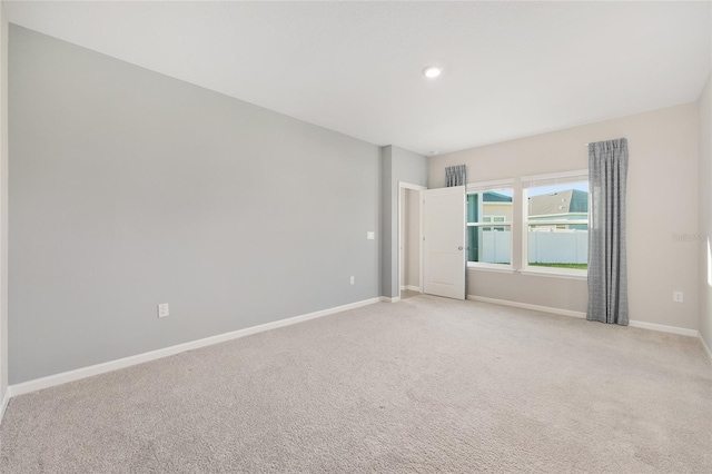 1875 NW 44 Court Rd, Ocala, FL 34482 - unfurnished room featuring baseboards, light carpet, and recessed lighting