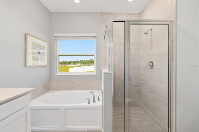 1875 NW 44 Court Rd, Ocala, FL 34482 - full bath with a stall shower, a garden tub, vanity, and recessed lighting