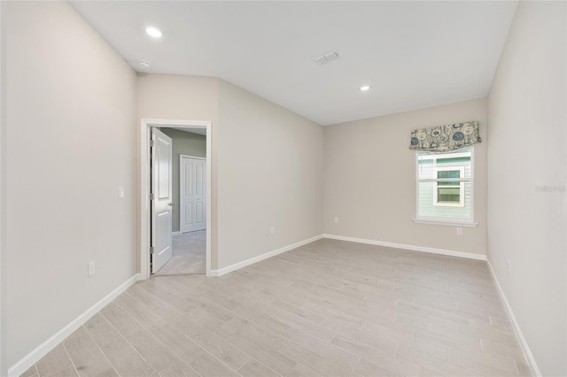 1875 NW 44 Court Rd, Ocala, FL 34482 - unfurnished room featuring light wood-style floors, baseboards, a smoke detector, and recessed lighting