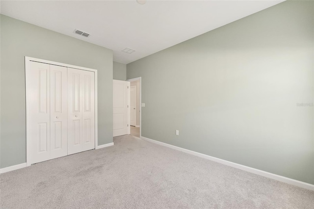 1875 NW 44 Court Rd, Ocala, FL 34482 - unfurnished bedroom featuring carpet floors, baseboards, and a closet