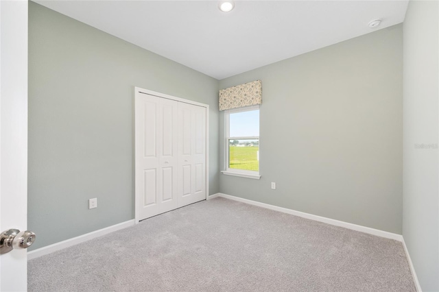 1875 NW 44 Court Rd, Ocala, FL 34482 - unfurnished bedroom featuring carpet floors, baseboards, a closet, and recessed lighting
