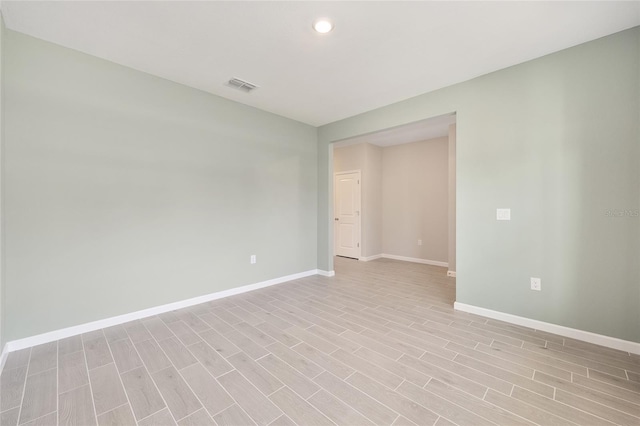 1875 NW 44 Court Rd, Ocala, FL 34482 - unfurnished room featuring baseboards, light wood-style flooring, and recessed lighting