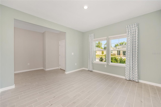1875 NW 44 Court Rd, Ocala, FL 34482 - empty room featuring baseboards, light wood-style floors, and recessed lighting