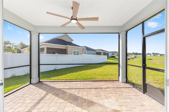 1875 NW 44 Court Rd, Ocala, FL 34482 - unfurnished sunroom with a ceiling fan and a residential view