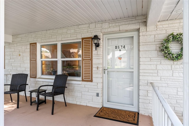 property entrance with stone siding