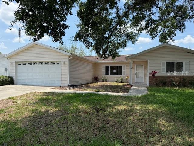 17522 SE 96th Ct, Summerfield, FL 34491 - ranch-style home with an attached garage, driveway, and a front yard