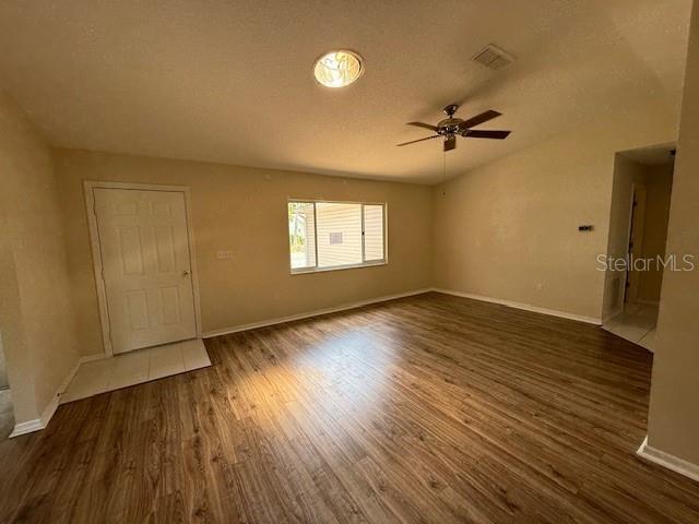 17522 SE 96th Ct, Summerfield, FL 34491 - spare room featuring a ceiling fan and wood finished floors