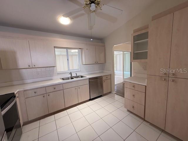 17522 SE 96th Ct, Summerfield, FL 34491 - kitchen featuring appliances with stainless steel finishes, light countertops, a ceiling fan, light tile patterned flooring, and light brown cabinets