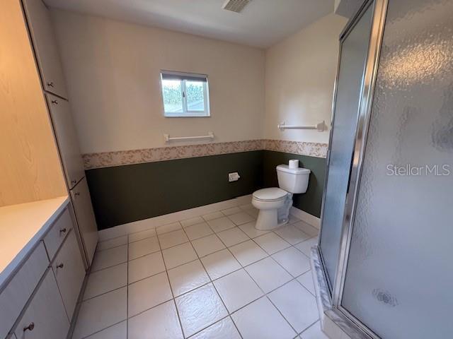 17522 SE 96th Ct, Summerfield, FL 34491 - full bath with a stall shower, vanity, and tile patterned floors