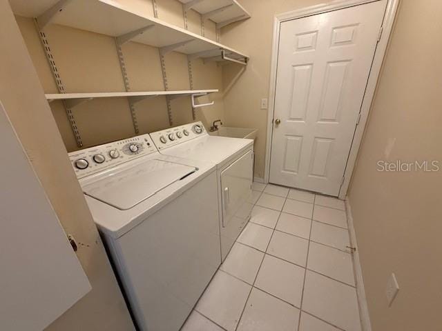 17522 SE 96th Ct, Summerfield, FL 34491 - laundry room featuring independent washer and dryer and light tile patterned floors