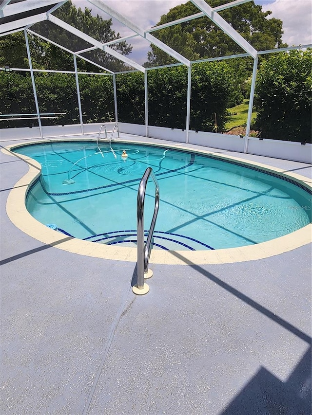 3891 N Grapefern Way, Beverly Hills, FL 34465 - outdoor pool featuring glass enclosure and a patio area