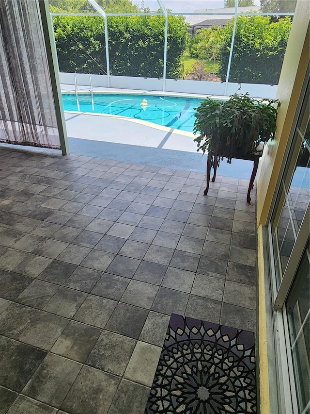 3891 N Grapefern Way, Beverly Hills, FL 34465 - swimming pool with glass enclosure and a patio area