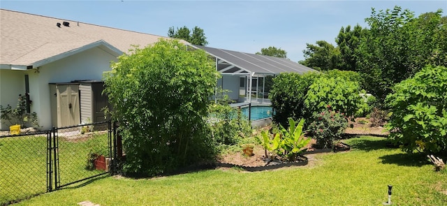 3891 N Grapefern Way, Beverly Hills, FL 34465 - view of green lawn featuring an outdoor pool, a gate, and glass enclosure