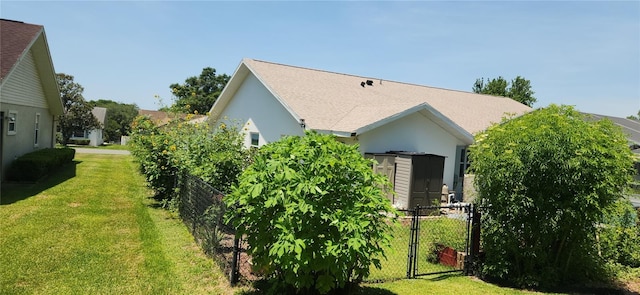 3891 N Grapefern Way, Beverly Hills, FL 34465 - view of side of property with stucco siding, a gate, and a shingled roof