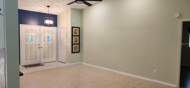3891 N Grapefern Way, Beverly Hills, FL 34465 - foyer entrance featuring a ceiling fan, high vaulted ceiling, baseboards, and light tile patterned floors