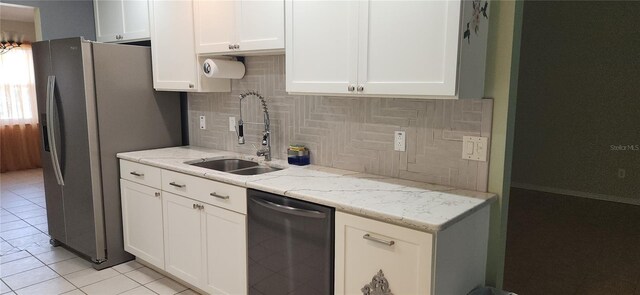3891 N Grapefern Way, Beverly Hills, FL 34465 - kitchen with a sink, tasteful backsplash, white cabinets, light tile patterned floors, and light stone countertops