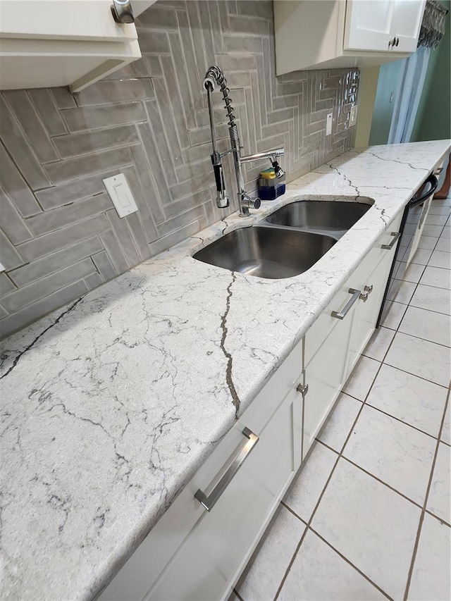 3891 N Grapefern Way, Beverly Hills, FL 34465 - kitchen with a sink, white cabinets, light stone counters, tasteful backsplash, and light tile patterned floors