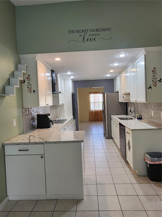 3891 N Grapefern Way, Beverly Hills, FL 34465 - kitchen featuring dishwasher, wall chimney range hood, light tile patterned floors, white cabinets, and recessed lighting