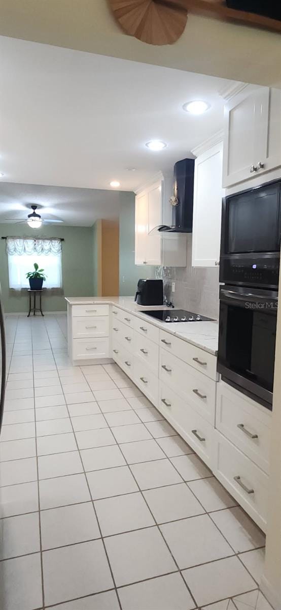 3891 N Grapefern Way, Beverly Hills, FL 34465 - kitchen featuring black appliances, wall chimney range hood, light tile patterned flooring, a peninsula, and recessed lighting
