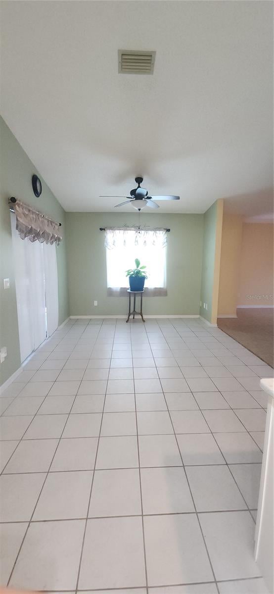 3891 N Grapefern Way, Beverly Hills, FL 34465 - spare room featuring ceiling fan, light tile patterned floors, and baseboards