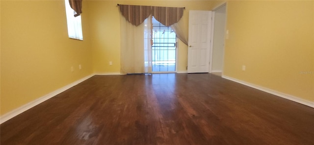 3891 N Grapefern Way, Beverly Hills, FL 34465 - empty room featuring baseboards and dark wood-style flooring