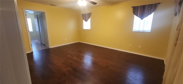 3891 N Grapefern Way, Beverly Hills, FL 34465 - spare room featuring healthy amount of natural light, a ceiling fan, dark wood finished floors, and baseboards