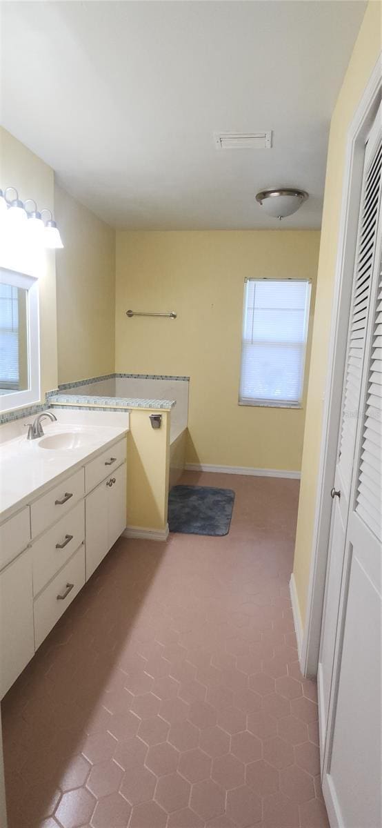 3891 N Grapefern Way, Beverly Hills, FL 34465 - bathroom featuring vanity, tile patterned floors, and baseboards