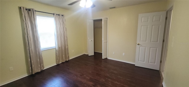 3891 N Grapefern Way, Beverly Hills, FL 34465 - unfurnished bedroom featuring dark wood-style flooring, multiple windows, baseboards, and a ceiling fan