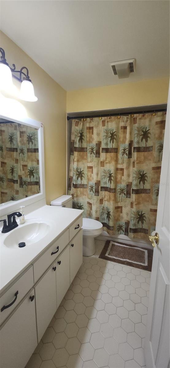 3891 N Grapefern Way, Beverly Hills, FL 34465 - full bathroom with toilet, vanity, and tile patterned flooring