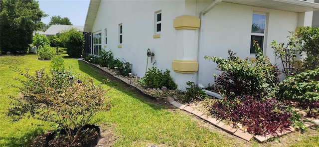 3891 N Grapefern Way, Beverly Hills, FL 34465 - view of home's exterior featuring stucco siding and a lawn