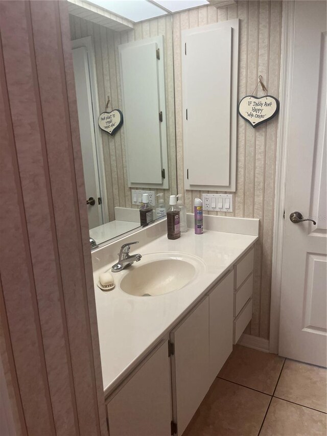 bathroom with tile patterned flooring and vanity