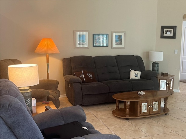 living room featuring light tile patterned flooring and baseboards
