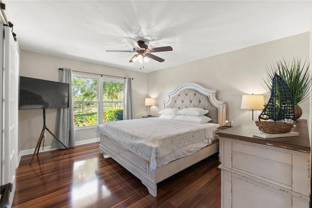 bedroom with dark wood finished floors, baseboards, and a ceiling fan