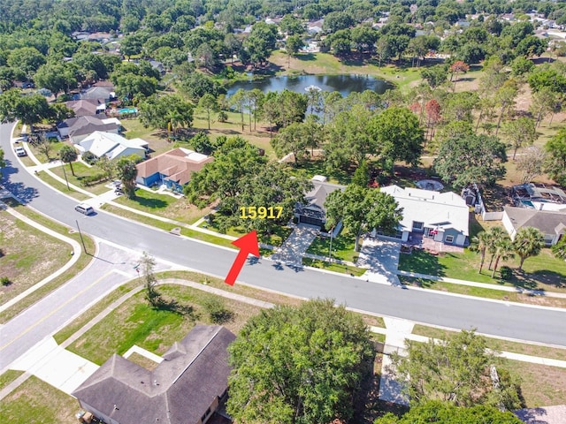 aerial perspective of suburban area featuring a large body of water