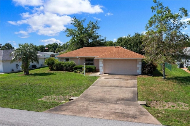 4992 NW 31st St, Ocala, FL 34482 - single story home with a garage, driveway, a front lawn, and stucco siding