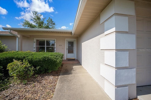 4992 NW 31st St, Ocala, FL 34482 - view of exterior entry featuring stucco siding