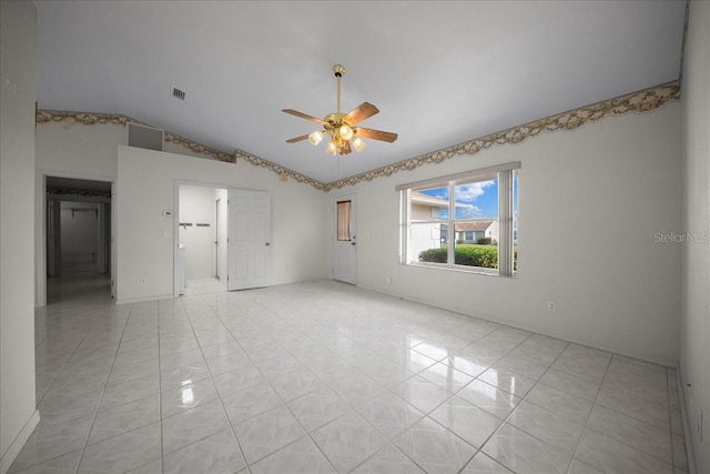 4992 NW 31st St, Ocala, FL 34482 - spare room with a ceiling fan, vaulted ceiling, and light tile patterned flooring