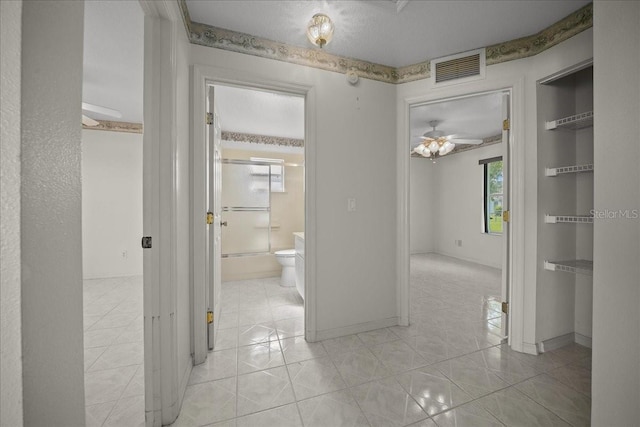 4992 NW 31st St, Ocala, FL 34482 - hallway with light tile patterned flooring and baseboards