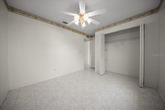 4992 NW 31st St, Ocala, FL 34482 - unfurnished bedroom featuring a closet, ceiling fan, and baseboards