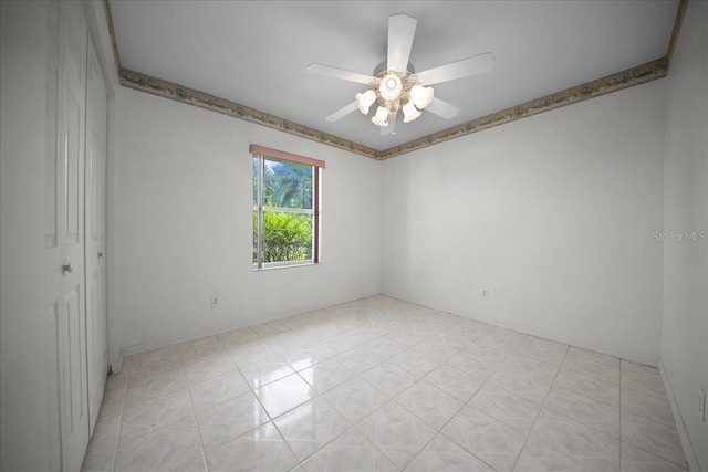 4992 NW 31st St, Ocala, FL 34482 - spare room with ceiling fan and baseboards