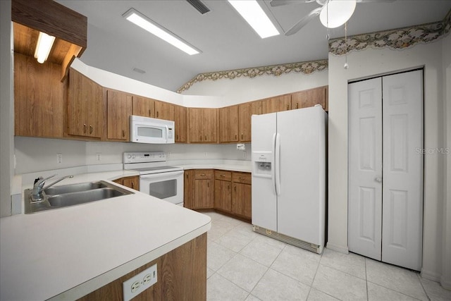 4992 NW 31st St, Ocala, FL 34482 - kitchen featuring white appliances, a sink, brown cabinets, lofted ceiling, and light countertops